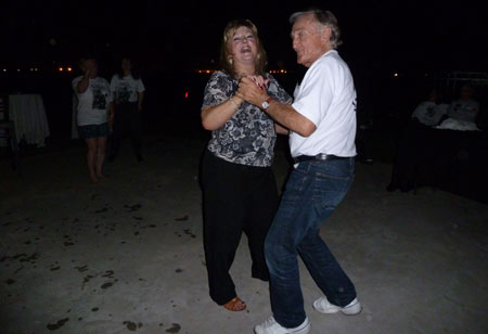 Rock ‘n’ Roll! Stuntman Lou Elias (James Stacy’s brother) dances at the pool party with Lacy Barras.