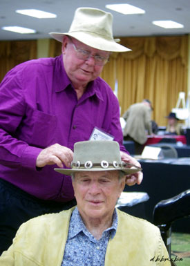 Costumer Luster Bayless makes a last minute adjustment on James Stacy’s hat. Luster graciously made the jacket Jim is wearing expressly for his appearance at “A Gathering of Guns”. Luster is best known for costuming John Wayne in his last 13 films. He now owns United American Costume Company in North Hollywood.