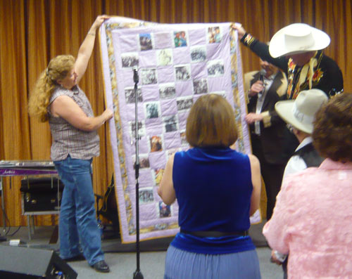 Donna Wilmeth presented her handmade Roy Rogers/Dale Evans quilt to Dusty Rogers at the end of the banquet. The ever gracious Donna handmade several other quits representing stars attending the festival and they were auctioned off to raise money for “A Gathering of Guns 4” May 31- June 2, 2012.