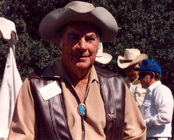 “Sheriff of Cochise”/“U.S. Marshal”John Bromfield at a Los Angeles event. In the background Clint Brown (blue hat) talks with stuntman Henry Wills.