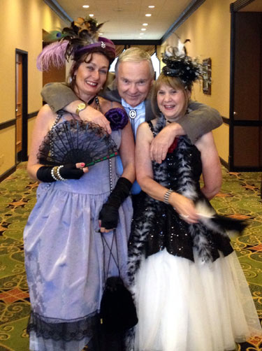 Boyd Magers smiles as he clings to Karla Caudill of Whispering Woods and festival co-ordinator Bonnie Boyd.