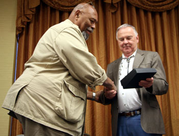 Don Pedro Colley accepts his award from Boyd Magers.