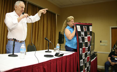 Prior to the “Virginian” panel Boyd Magers auctioned off a beautiful quilt made by Donna Wilmeth who holds it for the audience to see.