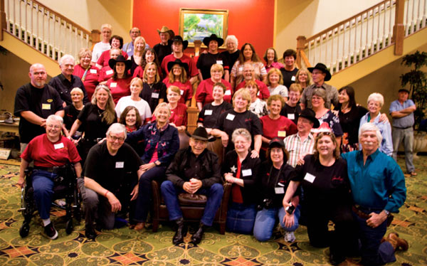 The cast of “The Virginian” surrounded by The Virginian Posse who turned out for the 50th anniversary of the series. (Front row l-r): Chris Braning, Ron Frederickson, Roberta Shore, James Drury, Karen Lindsey, Kelly Lucey,Pamela LeBaugh, L. Q. Jones. (Second row l-r): Jeff Mullins, Jan Glass, Nell Moore, Jennifer Glass, Sharon Klopfenstein, Patricia Prior, Sue Ketchum, Barb May, Jeannie Pugn, Randy Boone. (Third row l-r): Gary Clarke, Stephanie Landry, Mikki Shade, Sharon Schuman, Debbie Johnson, Susan Proctor, Don Quine, Tina Edmonds, Leta Burns, Sara Lane, Diane Roter, Juanita Smith. (Fourth row l-r): Alice Kunreuther, Sharon Landry, Lyn Beiler, Brad Schuman, Terry Bryant, Jeanne Irvine, Renee Jensen, Debbie Wilson, Terri Watson. (Fifth row l-r): Jeanette Wriston, Lynne Mercer, Jerry Klopfenstein, Lynn Kvalheim, Nic Fewer. Standing off to the right of the photo is Patie O’Sullivan.