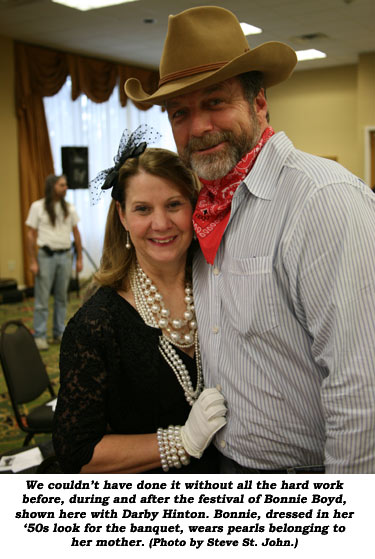 We couldn't have done it without all the hard work before, during and after the festival of Bonnie Boyd, shown here with Darby Hinton. Bonnie, dressed in her '50s look for the banquet, wears pearls belonging to her mother.  (Photo by Steve St. John.)