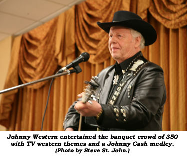 Johnny Western entertained the banquet crowd of 350 with TV western themes and a Johnny Cash medley. (Photo by Steve St. John.)