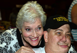 Gracious Lee Meriwether poses with a fan.