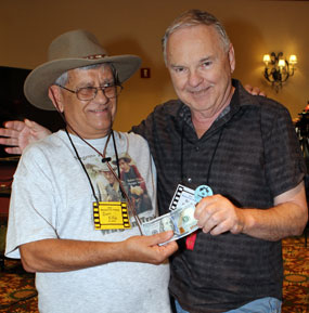 Don Ellis, Trivia Contest winner three years in a row, accepts his $100 prize from WC’s Boyd Magers.