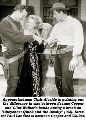 Appears badman Chris Alcaide is pointing out the difference in size between Jeanne Cooper and Clint Walker's hands during a break on "Cheyenne: Quick and the Deadly" ('62). Director Paul Landres is between Cooper and Walker.