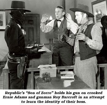 Republic's "Son of Zorro" holds his gun on crooked Ernie Adams and gunman Roy Barcroft in an attempt to learn the identity of their boss.