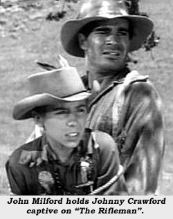 John Milford holds Johnny Crawford captive on "The Rifleman".