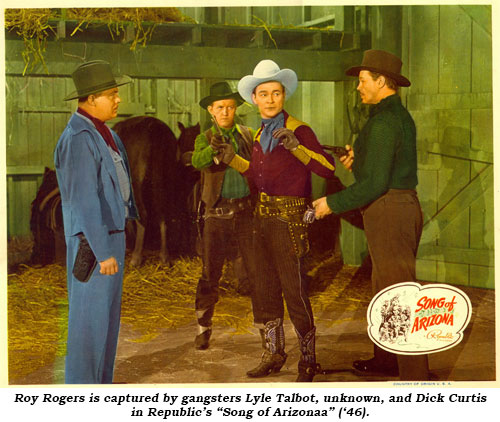 Roy Rogers is captured by gangsters Lyle Talbot, unknown and Dick Curtis in Republic's "Song of Arizona" ('46).
