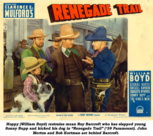 Hoppy (William Boyd) restrains mean Roy Barcroft who has slapped young Sonny Bupp and kicked his dog in "Renegade Trail" ('39 Paramount). John Merton and Bob Kortman are behind Barcroft.