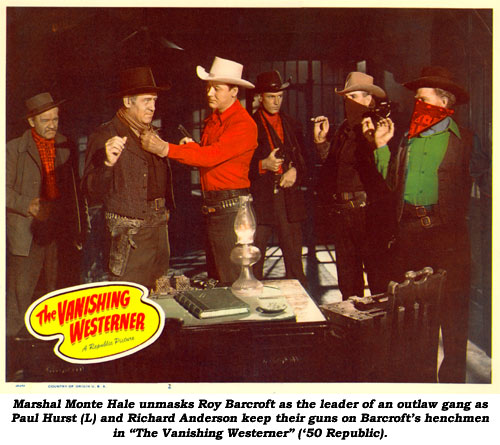 Marshal Monte Hale unmasks Roy Barcroft as the leader of "The Missourians" gang as Paul Hurst (L) and Richard Anderson keep their guns on Barcroft's henchmen.