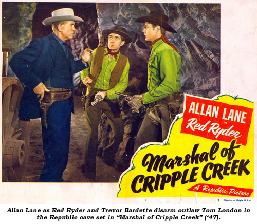 Allan Lane as Red Ryder and Trevor Bardette disarm outlaw Tom London in the Republic cave set in "Marshal of Cripple Creek" ('47).