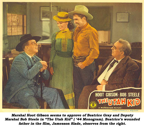 Marshal Hoot Gibson seems to approve of Beatrice Gray and Deputy Marshal Bob Steele in “The Utah Kid” ( ‘44 Monogram). Beatrice’s wounded father in the film, Jamesson Slade, observes from the right.