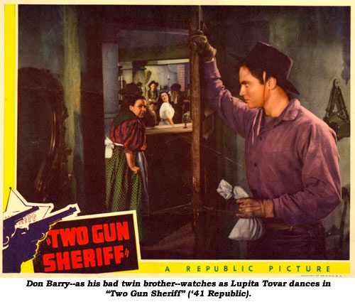 Don Barry--as his bad twin brother--watches as Lupita Tovar dances in "Two Gun Sheriff" ('41 Republic).