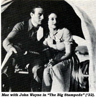 John Wayne holds Mae's hand in Warner Bros.' "The Big Stampede" ('32).