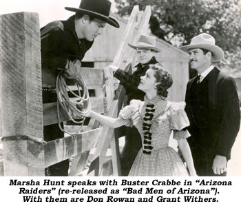 Marsha Hunt speaks with Buster Crabbe in "Arizona Raiders" (re-released as "Bad Men of Arizona"). With them are Don Rowan and Grant Withers.