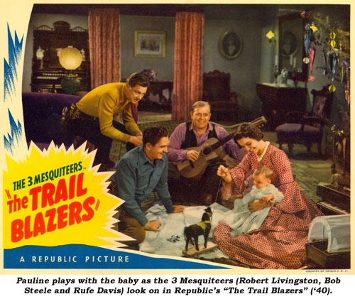 Pauline plays with the baby as the 3 Medquiteers (Robert Livingston, Bob Steele and Rufe Davis) look on in Republic's "The Trail Blazers" ('40).