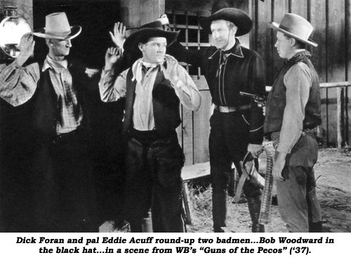 Dick Foran and pal Eddie Acuff round-up two badmen...Bob Woodward in the black hat...in a scene from WB's "Guns of the Pecos" ('37).