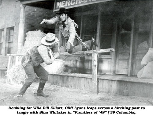 Doubling for Wild Bill Elliott, Cliff Lyons leaps across a hitching post to tangle with Slim Whitaker in "Frontiers of '49" ('39 Columbia).