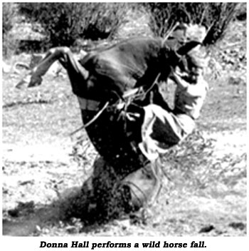 Donna Hall performs a wild horse fall.