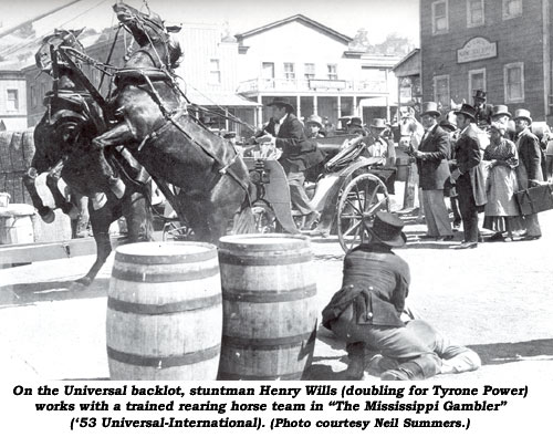 On the Universal backlot, stuntman Henry Wills (doubling for Tyrone Power) works with a trained rearing horse team in "The Mississippi Gambler" ('53 Universal-International). (Photo courtesy Neil Summers.)