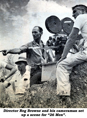 Director Reg Browne and his cameraman set up a scene for "26 Men".