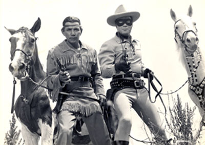 Tonto (Jay Silverheels) and The Lone Ranger (Clayton Moore) with their horses, Scout and Silver.