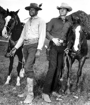 Don Murray and Otis Young with their horses.
