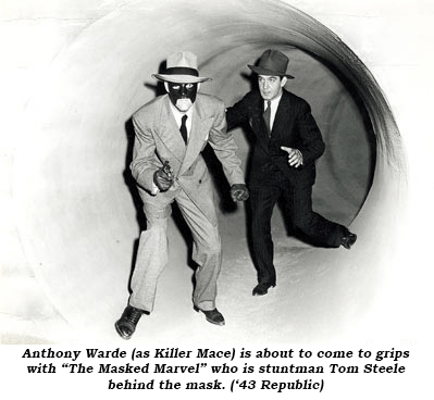Anthony Warde (as Killer Mace) is about to come to grips with "The Masked Marvel" who is stuntman Tom Steele behind the mas. ('43 Republic).