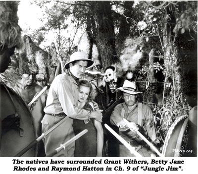 The natives have surrounded Grant Withers, Betty Jane Rhodes and Raymond Hatton in Ch. 9 of "Jungle Jim".