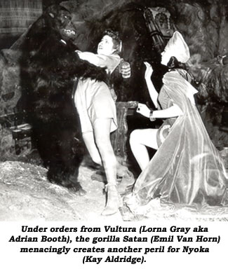 Under orders from Vultura (Lorna Gray aka Adrian Booth), the gorilla Satan (Emil Van Horn) menacingly creates another peril for Nyoka (Kay Aldridge).