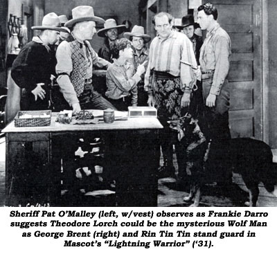 Sheriff Pat O'Malley (left, w/vest) observes as Frankie Darro suggests Theodore Lorch could be the mysterious Wolf Man as George Brent (right) and Rin Tin Tin stand guard in Mascot's "Lightning Warrior" ('31).
