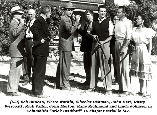 (L-R) Bob Duncan, Pierre Watkin, Wheeler Oakman, John Hart, Rusty Wescoatt, Rick Vallin, John Merton, Kane Richmond and Linda Johnson in Columbia's "Brick Bradford" 15 chapter serial in '47.