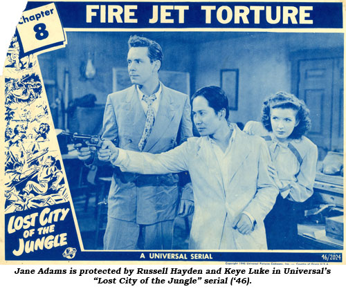 Jane Adams is protected by Russell Hayden and Keye Luke in Universal's "Lost City of the Jungle" serial ('46).
