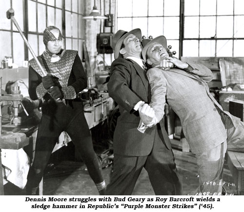 Dennis Moore struggles with Bud Geary as Roy Barcroft wields a sledge hammer in Republic's "Purple Monster Strikes" ('45).