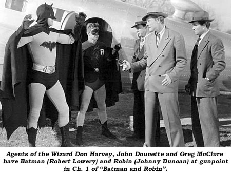 Agents of the Wizard Don Harvey, John Doucette and Greg McClure have Batman (Robert Lowery) and Robin (Johnny Duncan) at gun point in Ch. 1 of "Batman and Robin".