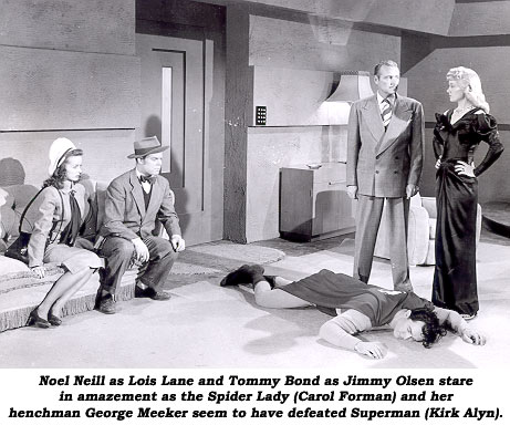 Noel Neill as Lois Lane and Tommy Bond as Jimmy Olsen stare in amazement as the Spider Lady (Carol Forman) and her henchman George Meeker seem to have defeated Superman (Kirk Alyn).