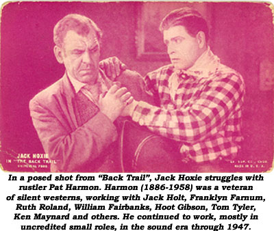 Jack Hoxie and Pat Harmon in a posed shot from "Back Trail".