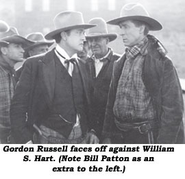 Gordon Russell faces off against William S. Hart. (Note Bill Patton as an extra to the left.)