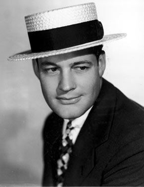 Charles Starrett in straw hat.