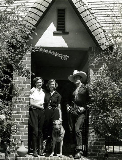 Buck Jones with his wife Dell and daughter maxine in front of their California home.