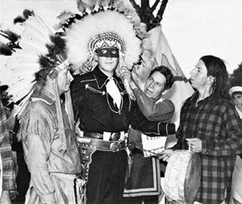 Radio’s Lone Ranger, Brace Beemer, poses wearing a feathered head dress with the chief of the Chippewa Nation and other tribe members during the 49th annual Indian Fair in 1946. (Photo courtesy Roy Bonario.) 