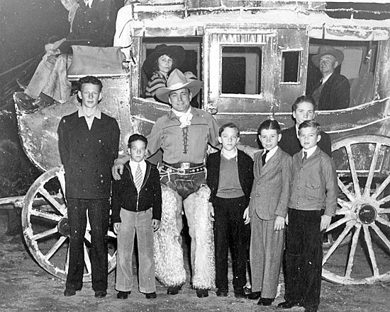 Buck Jones and some boys from the McKinley Home for Boys in Sherman Oaks, CA perpare for a Christmas Parade. The McKinley Home operated from 1920-1960. 