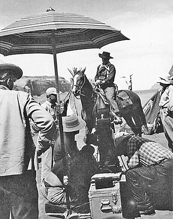 John Ford (right) directs John Wayne in a scene for “The Searchers” in 
Monument Valley. 