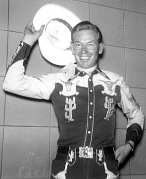 A young Rex Allen at WLS Radio, Chicago, circa 1945 seems to say, “See ya next month here on Western Treasures!” 