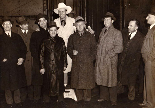 Gene Autry greets a group of theater owners. (Note the pedestal.) 
