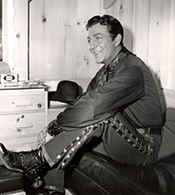 Robert Taylor relaxes in his dressing room during the making of “Ride, Vaquero” 
(‘53 MGM).